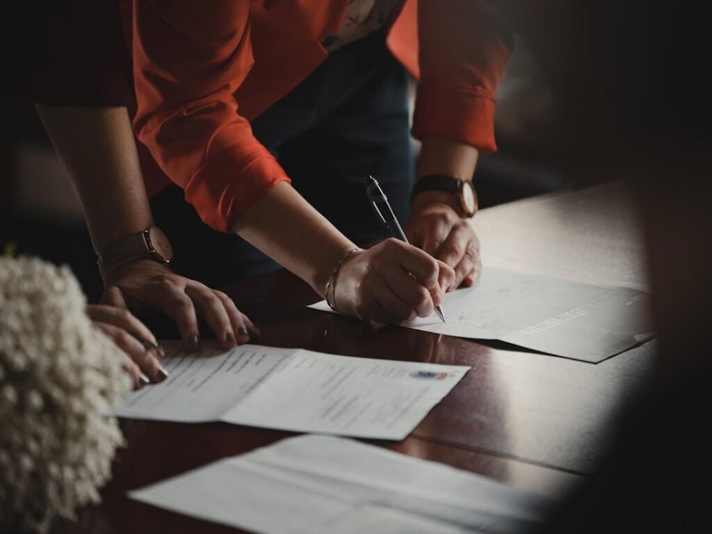 Two business professionals going over paperwork from a feasibility study to determine the competitive landscape in self-storage industry